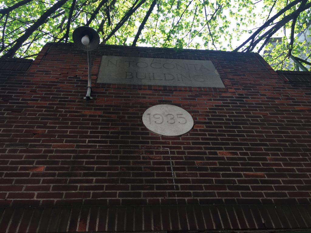 Looking Up, We See The Building Is About 80 Years Old